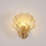 Wall lamp in the shape of a shell