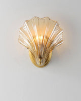 Wall lamp in the shape of a shell
