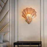 Wall lamp in the shape of a shell